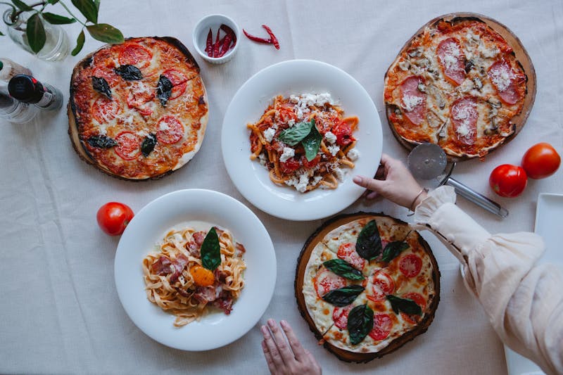 Ultimate Artisan Bundle — two signature pizzas with appetizers